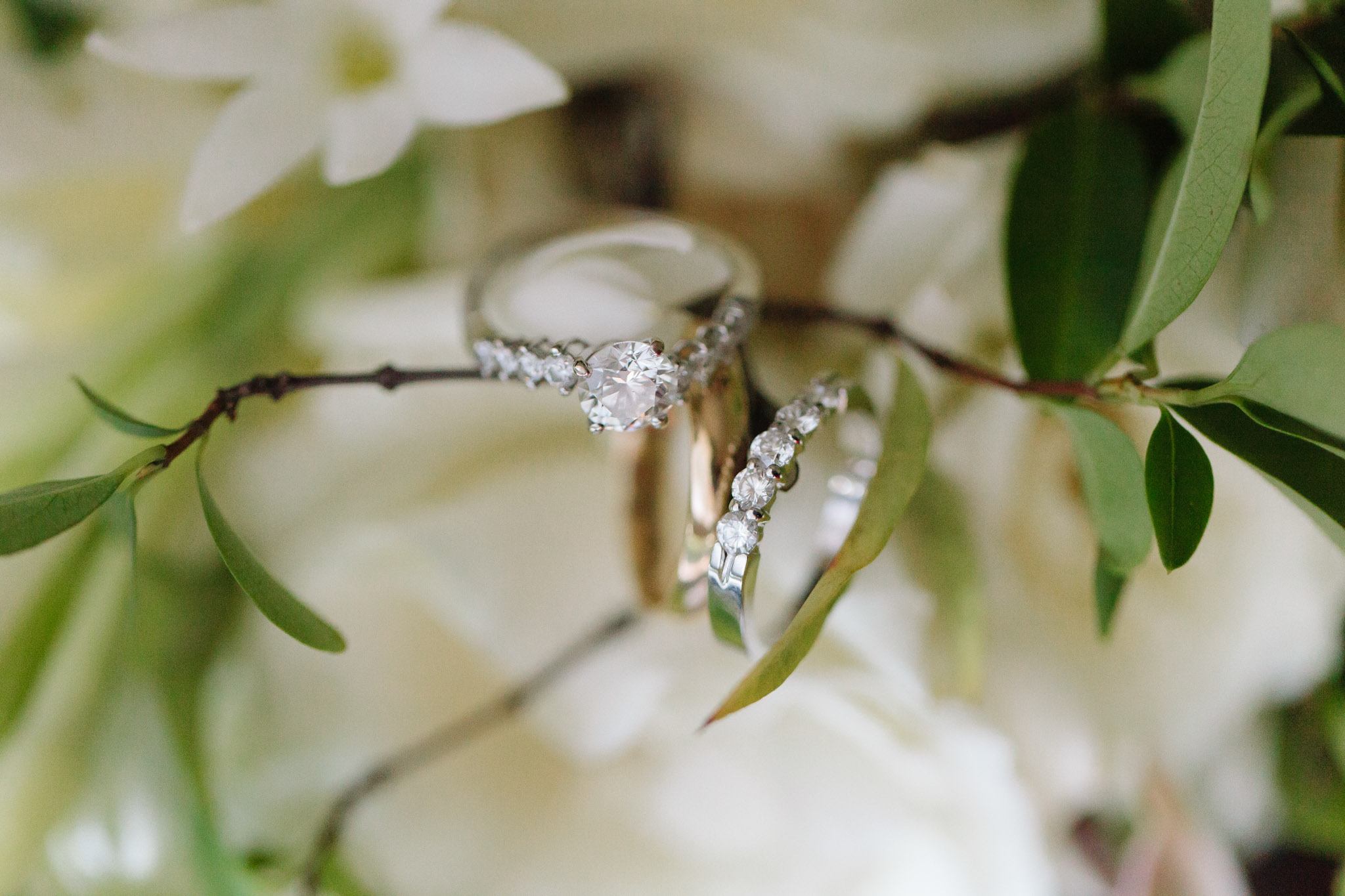 Summerour's top wedding photographer Rebecca Cerasani uses delicate florals to style a wedding ring shot.