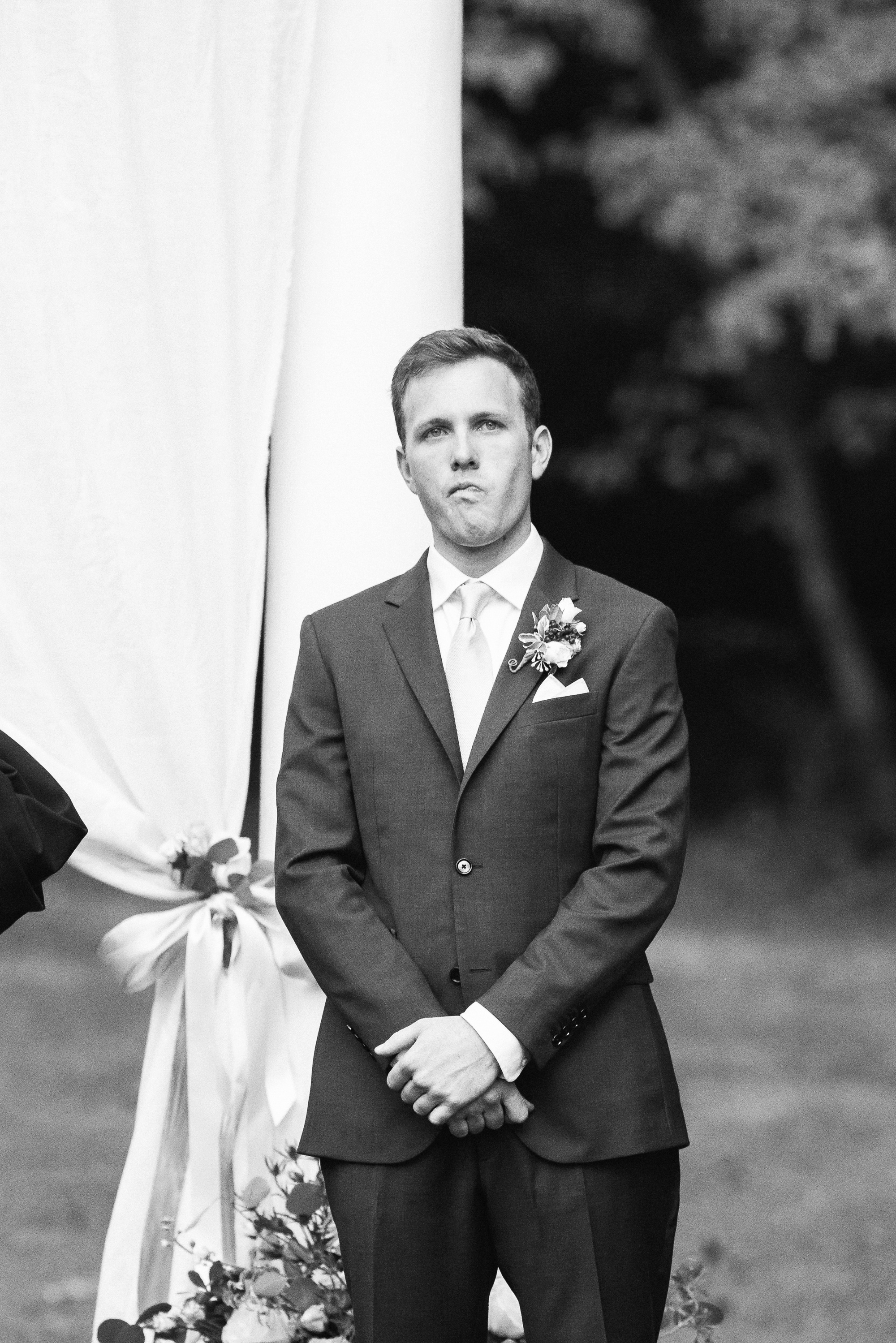 Sean fights tears as the moment his bride enters his view.
