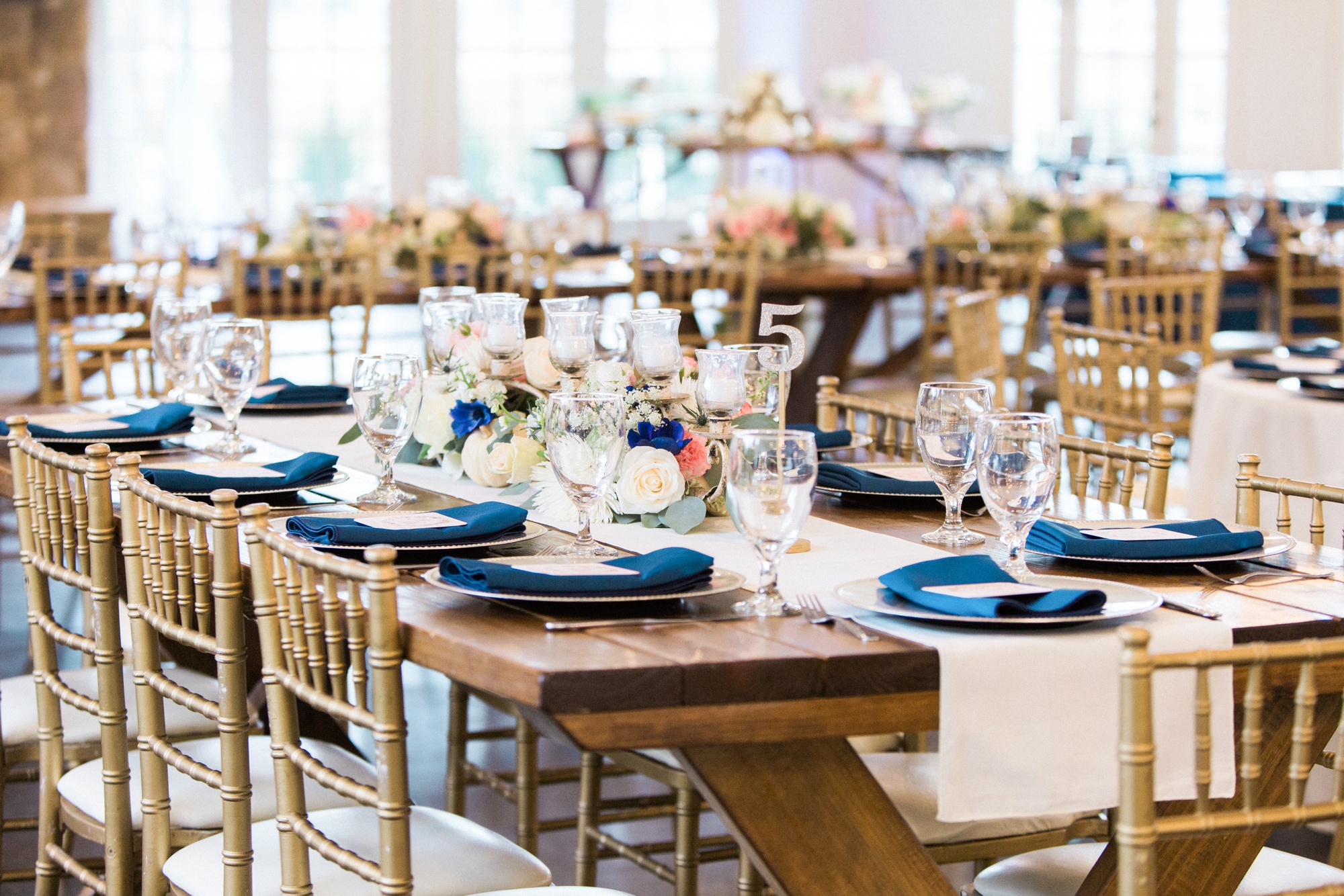 Rustic chic table scapes set the tone for this reception at Little River Farms.