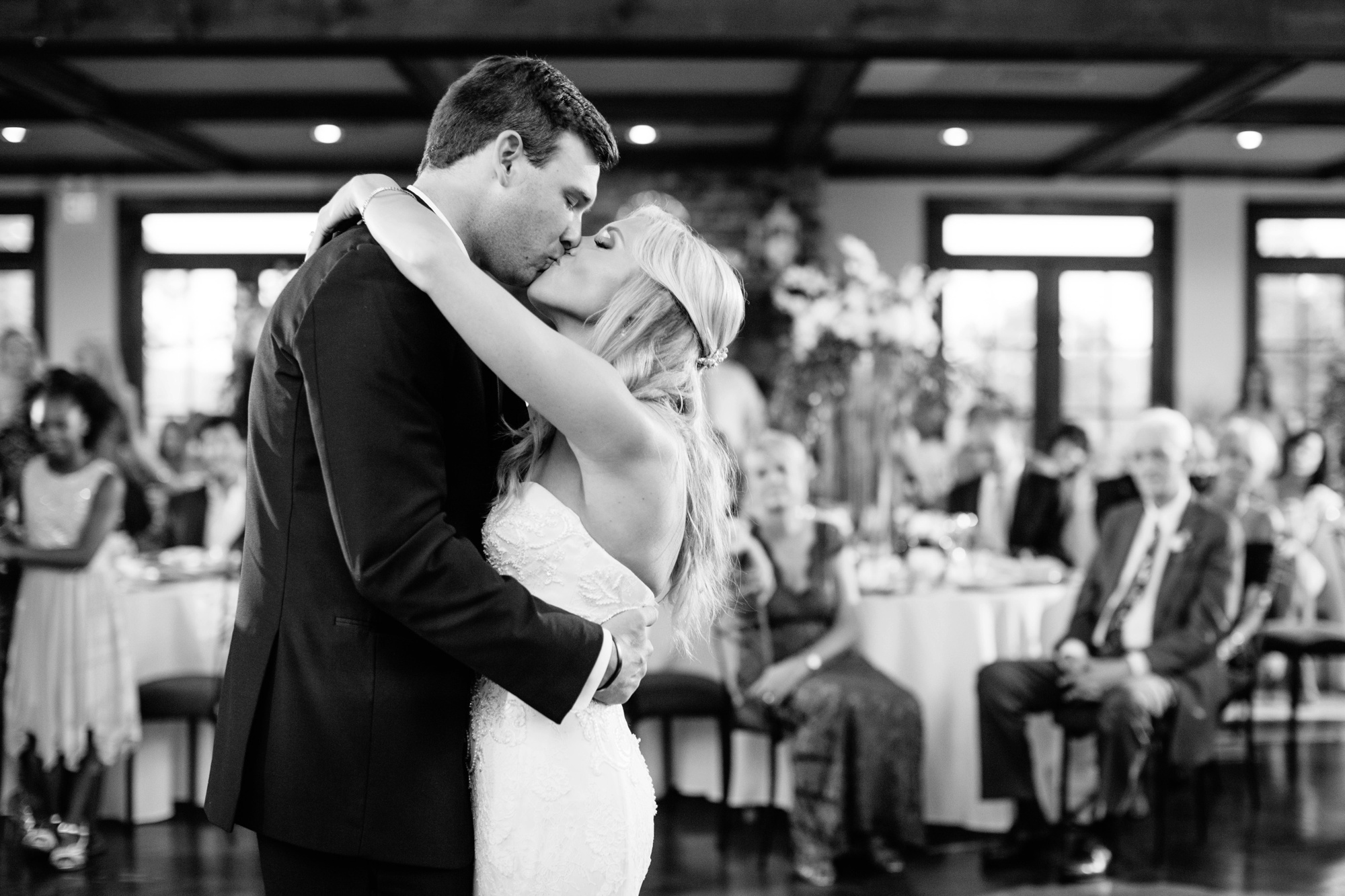 Kisses during the first dance are the best. Love this classic black and white picture captured perfectly by Atlanta's premier luxury wedding photographer Rebecca Cerasani