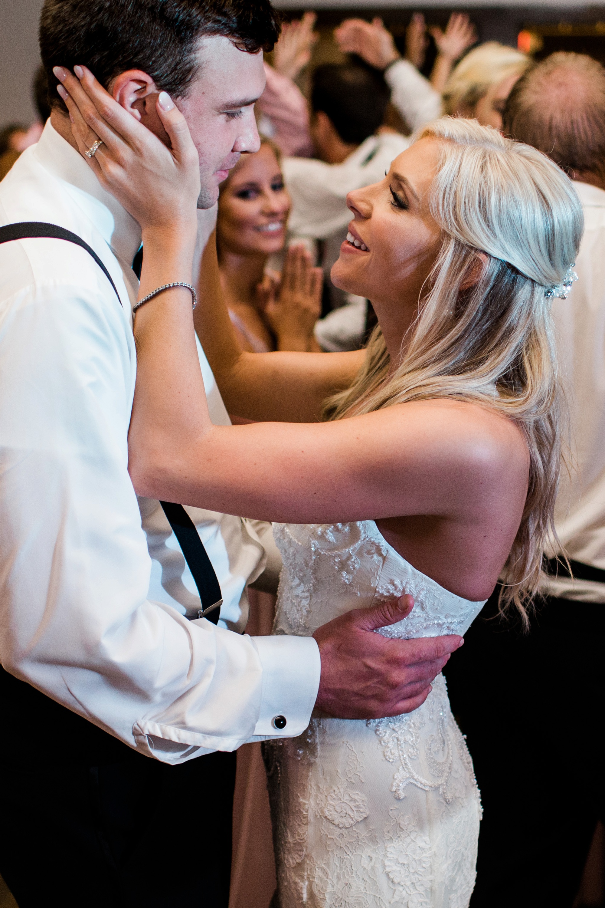 Sweet moment on the dance floor between bride and groom captured by Rebecca Cerasani