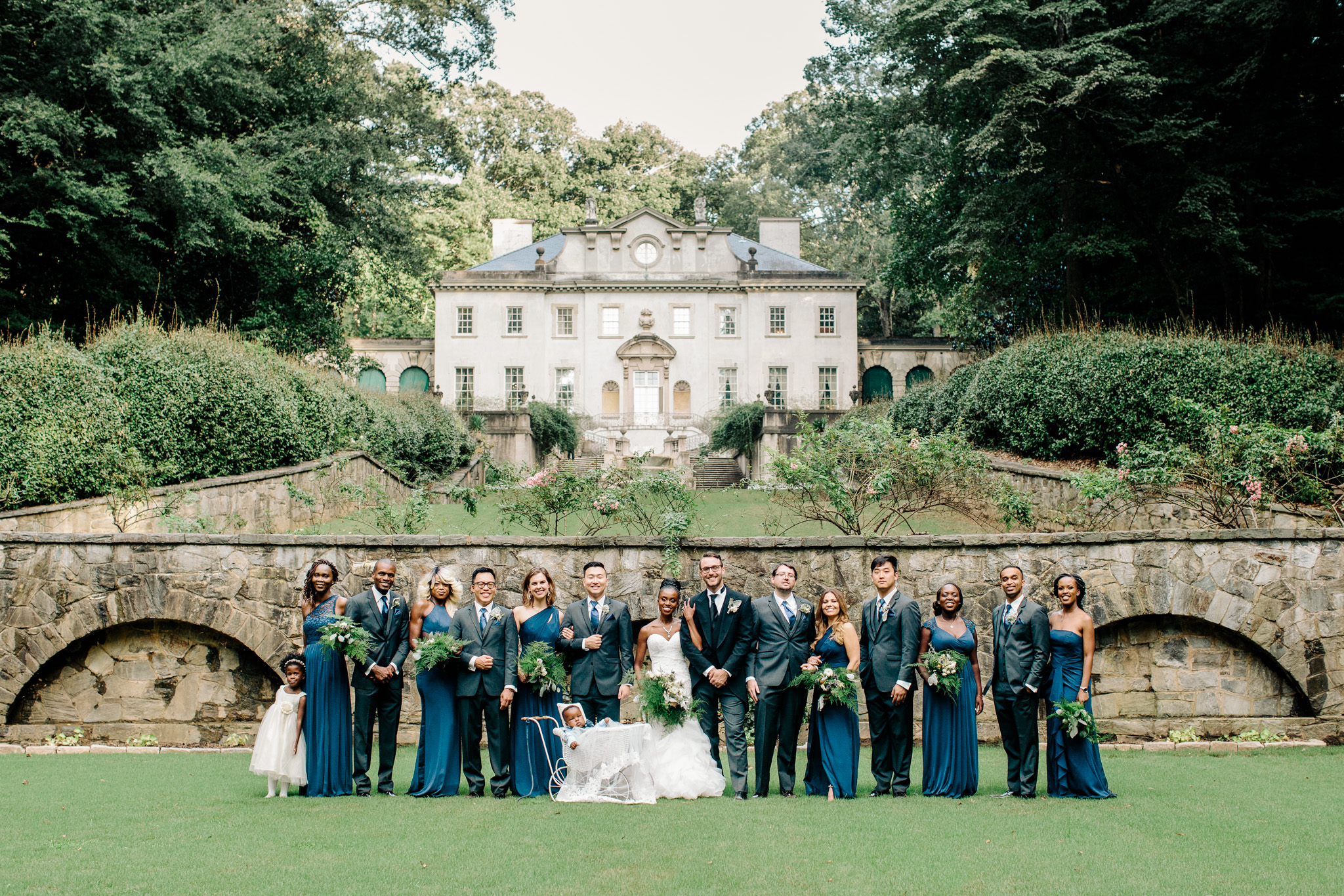 This bridal party group shot in front of the Swan House was captured by Atlanta based photographer Rebecca Cerasani