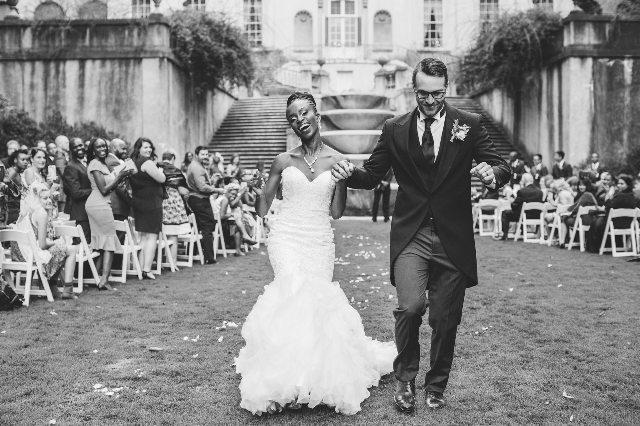 Emotional wedding exit by Atlanta's premier wedding photographer Rebecca Cerasani