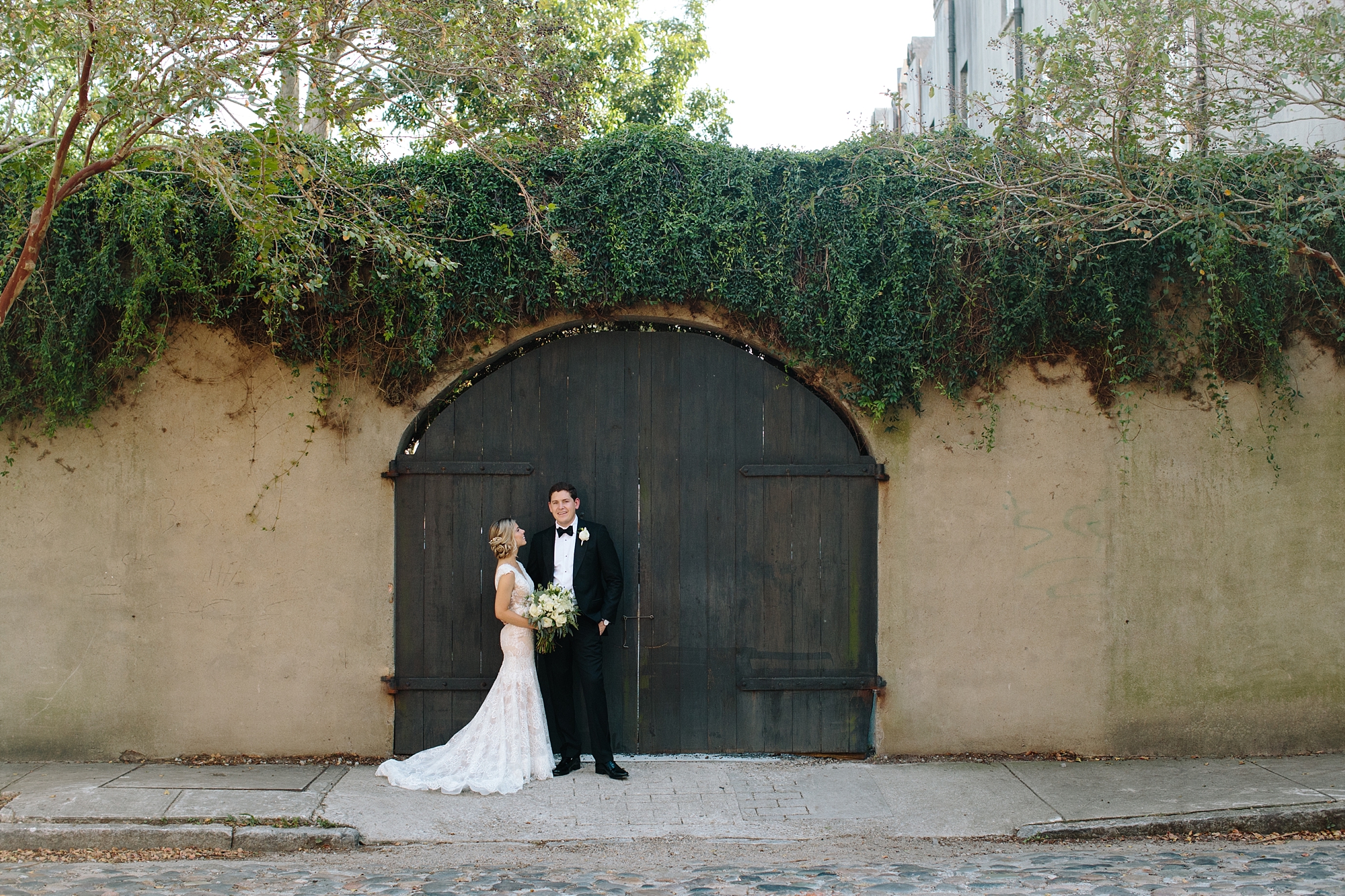 Best First Look ever. Soft pink and teal blue romantic wedding in Historic Charleston, South Carolina by top Wedding Photographers Leigh and Becca.
