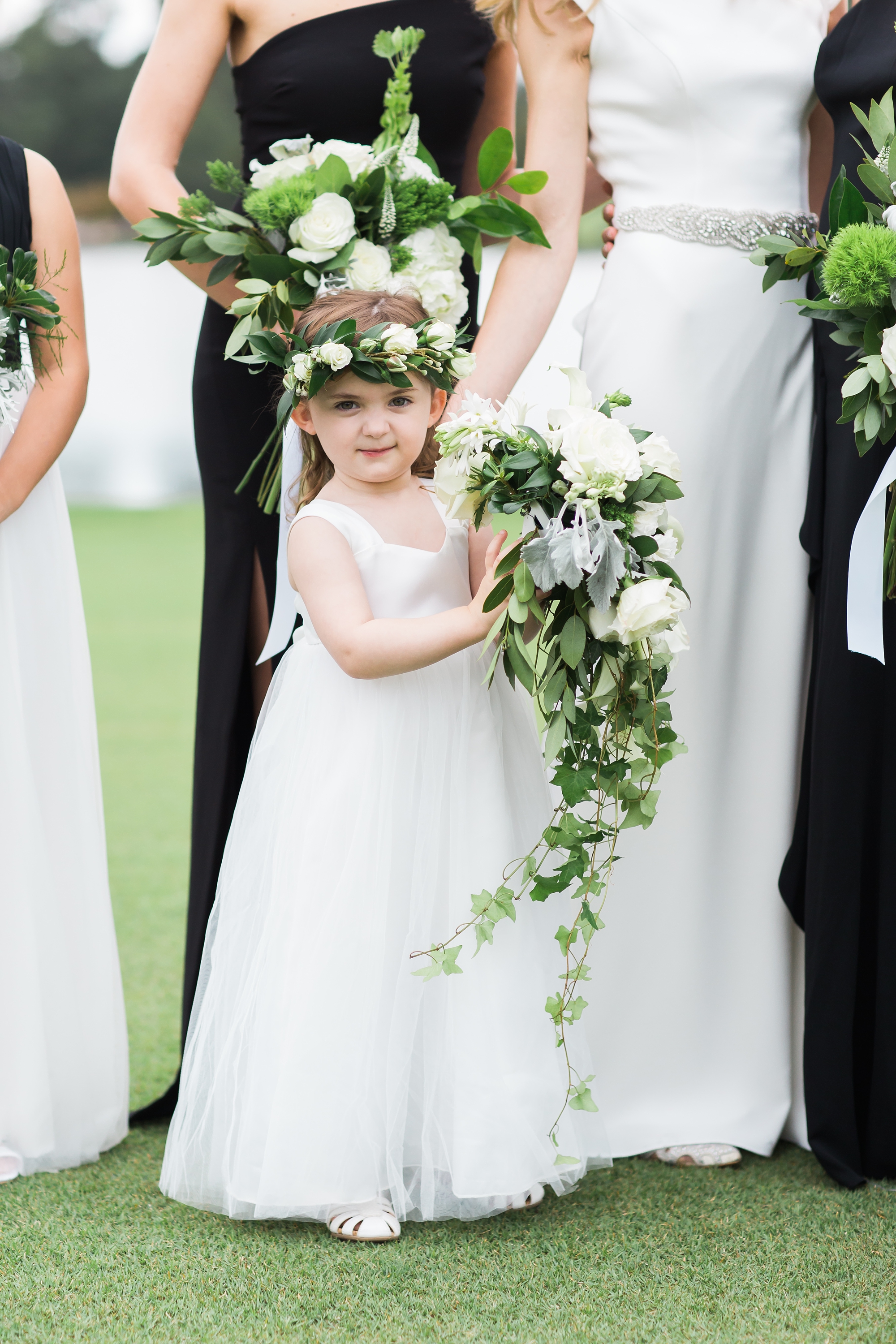 Adorable flower girl in a white flower crown at East Lake Golf Club by Top Atlanta Wedding Photographers Leigh and Becca