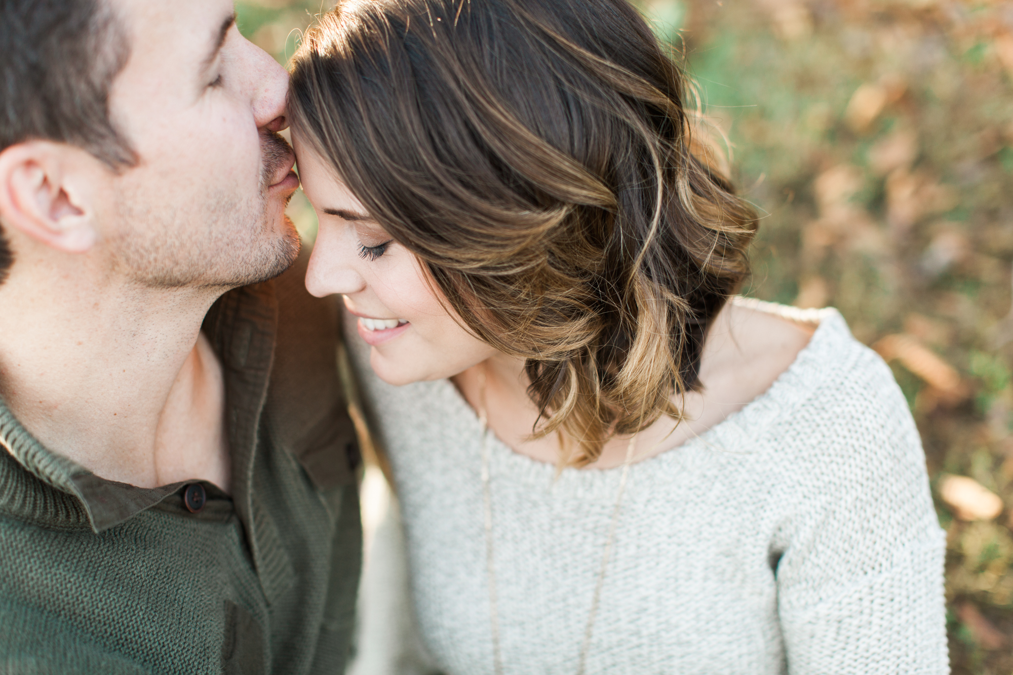Sweet kisses during engagement session always make the sweetest photos.