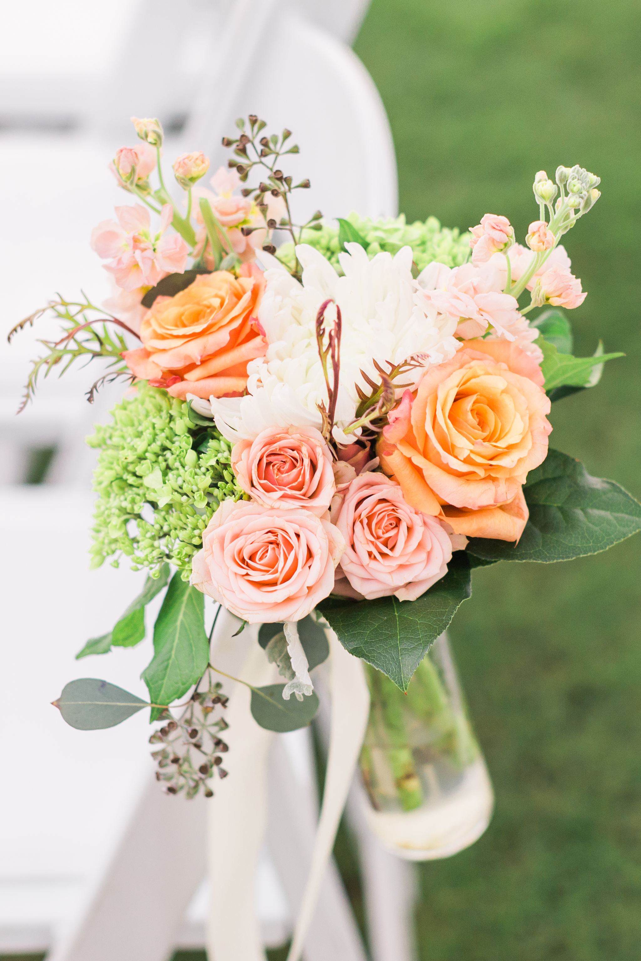 These aisle flowers were perfect for this outdoor Spring wedding!