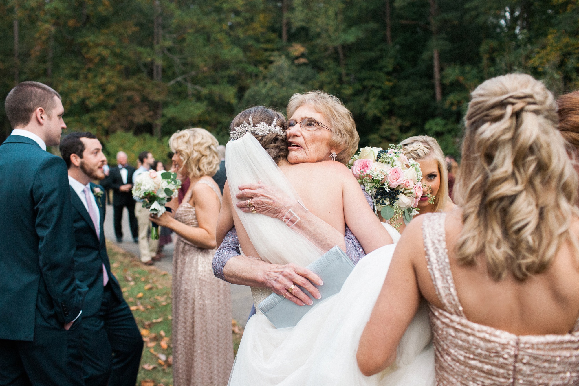 Family embraces bride with warm congratulations!
