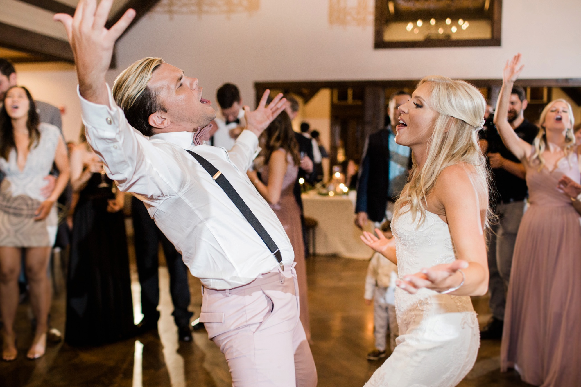 Your wedding reception should be a party! Make sure you have a photographer who is ready to party with you! Photo by Rebecca Cerasani