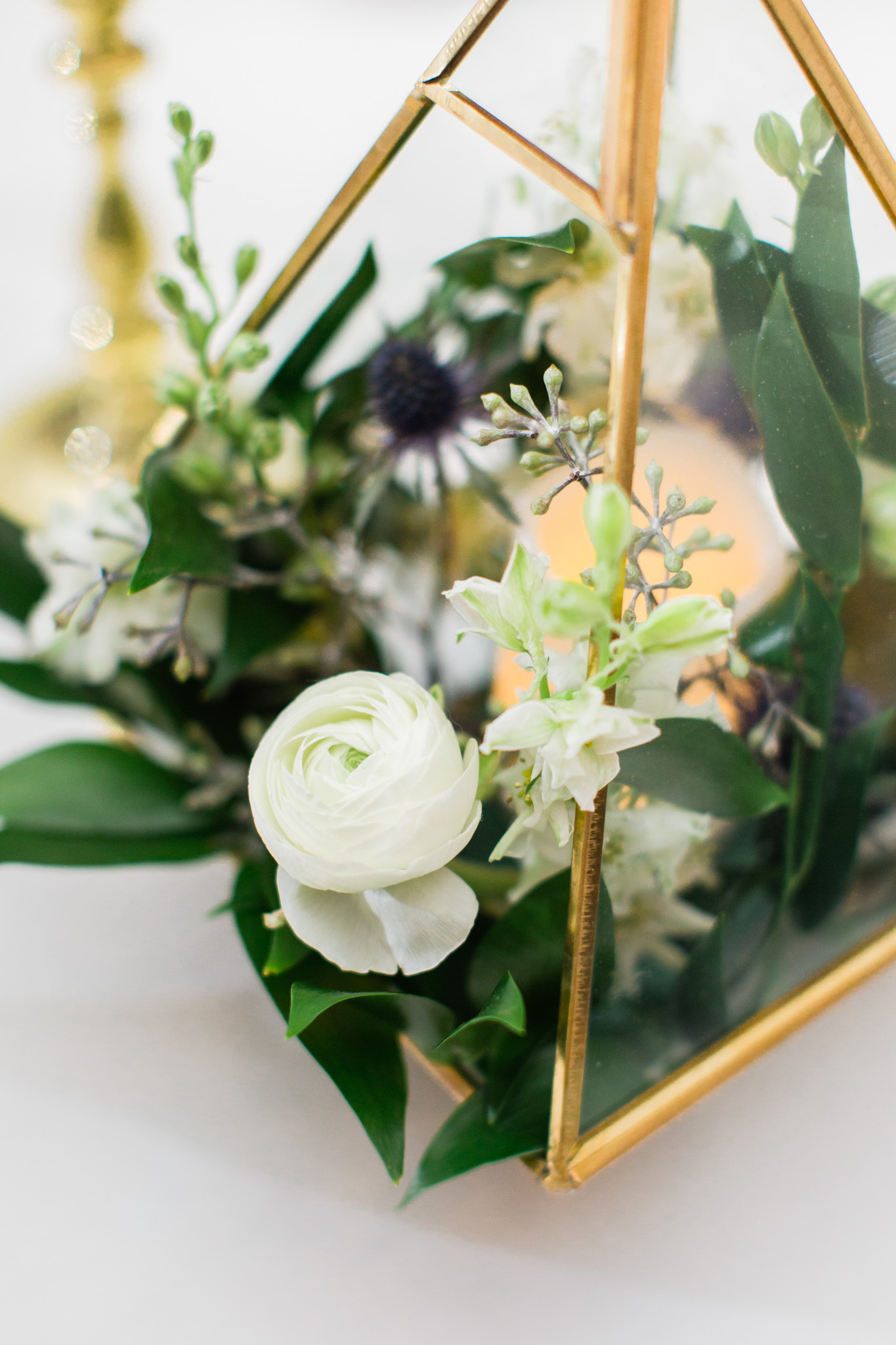 Floral and gold reception details at the Swan House. Photo by Rebecca Cerasani