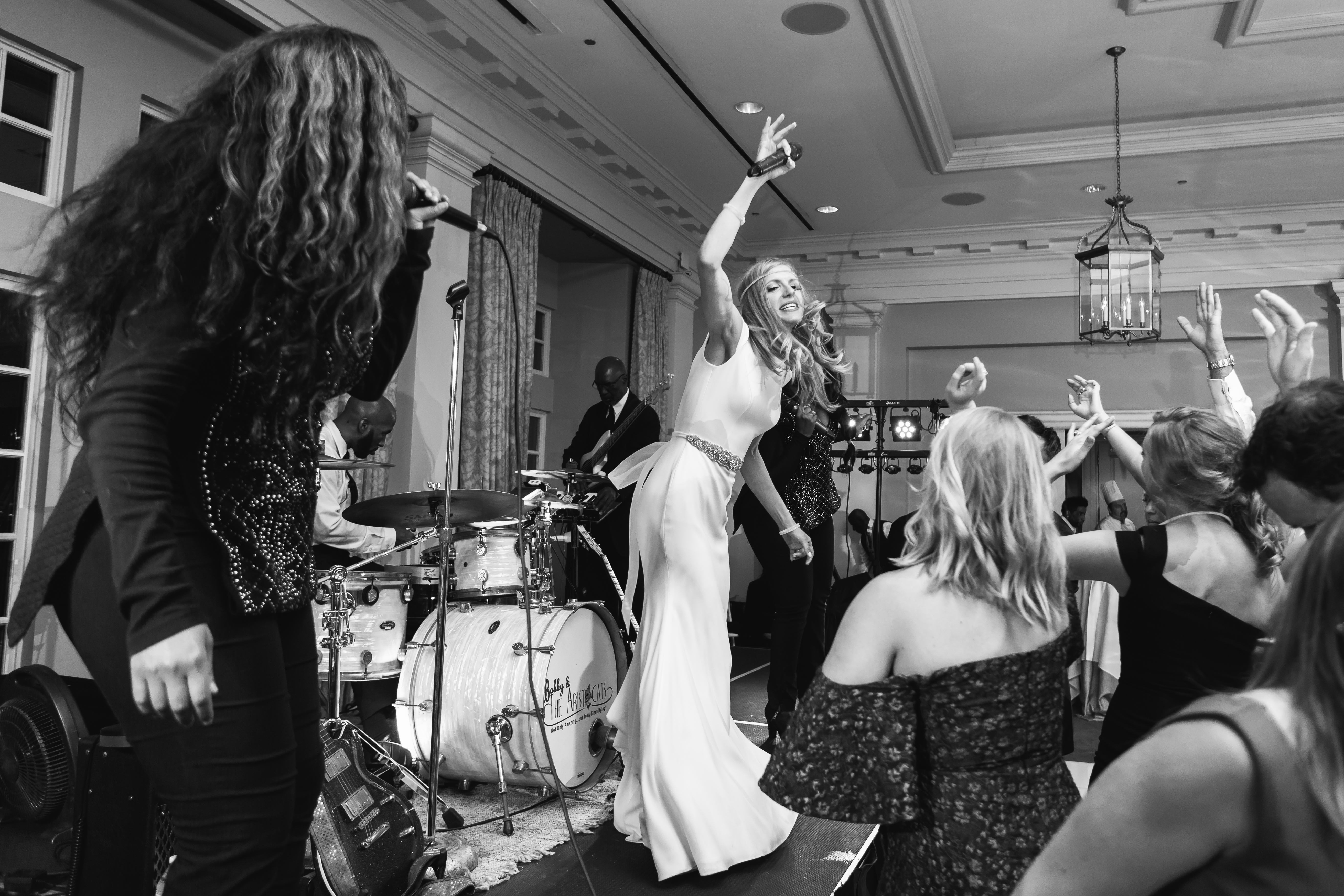Stephanie lives out her rock star dreams on stage as she sings alongside Bobby and the Aristocrats with East Coast Entertainment. Photo by top Atlanta Photographer Rebecca Cerasani.