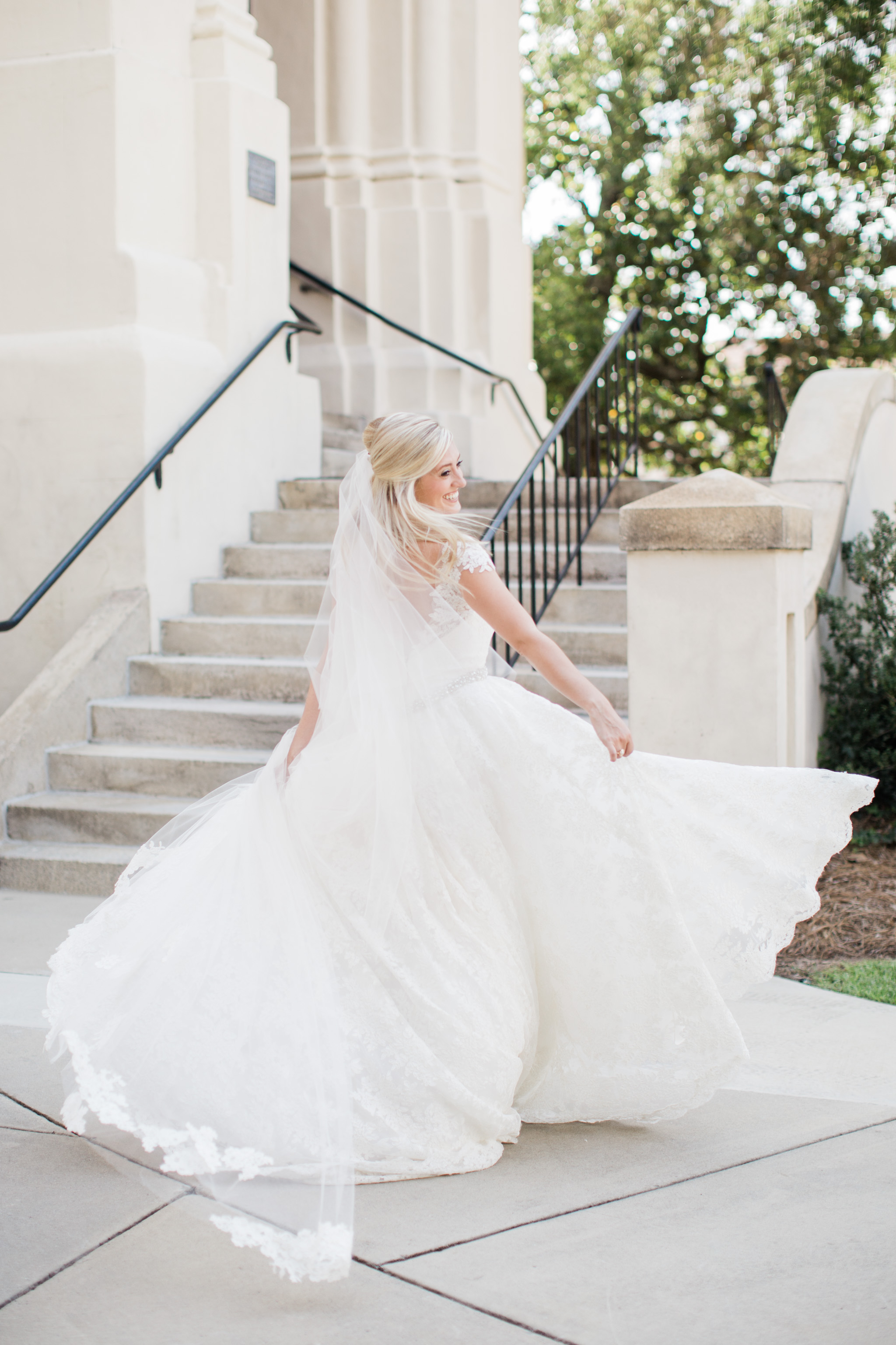 Sometimes girls just want to have fun. This bride was all joy as she spun in her wedding dress. Photo by Rebecca Cerasani, photographer for the luxury bride.