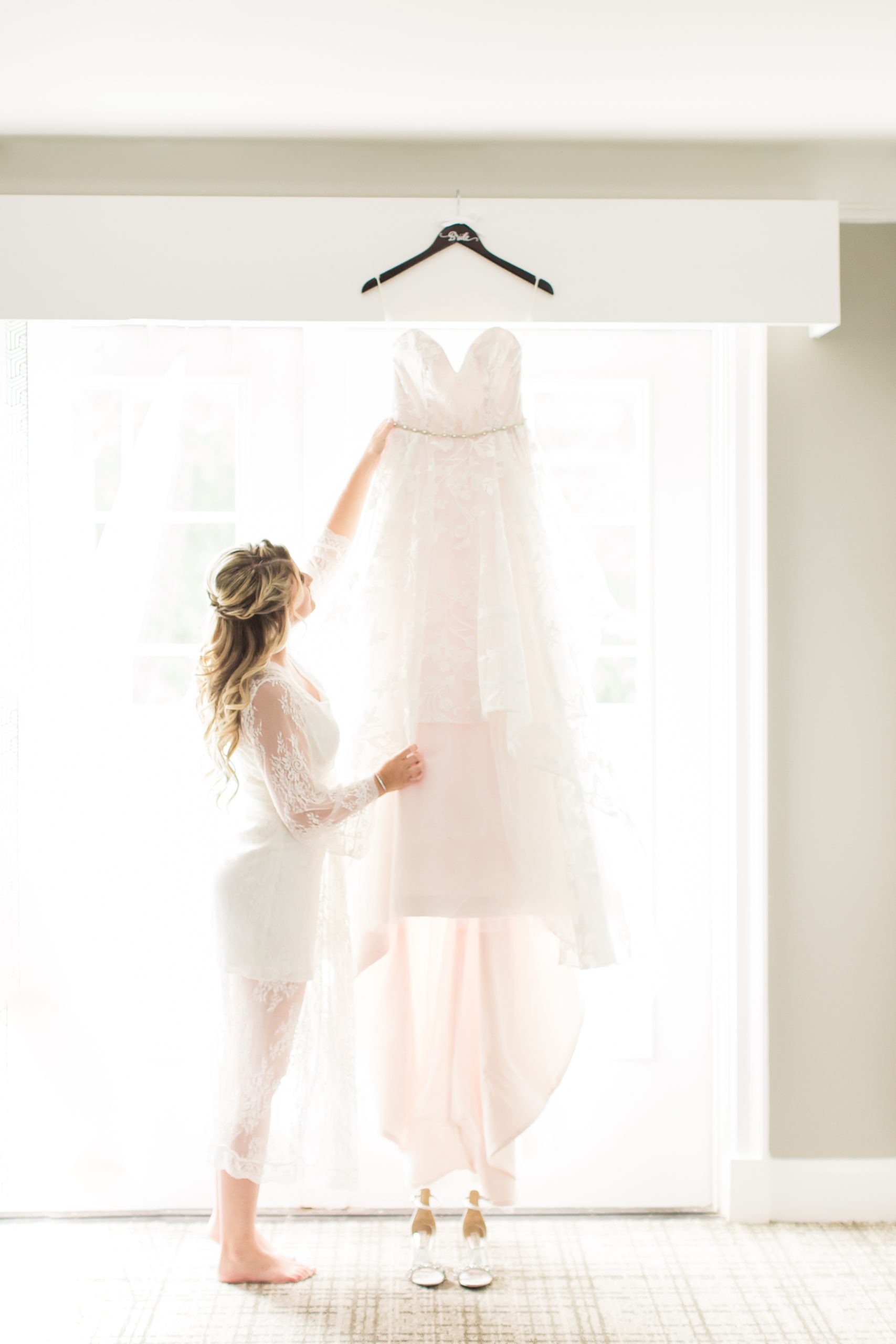 Bride reaches for her Hayley Paige Gown